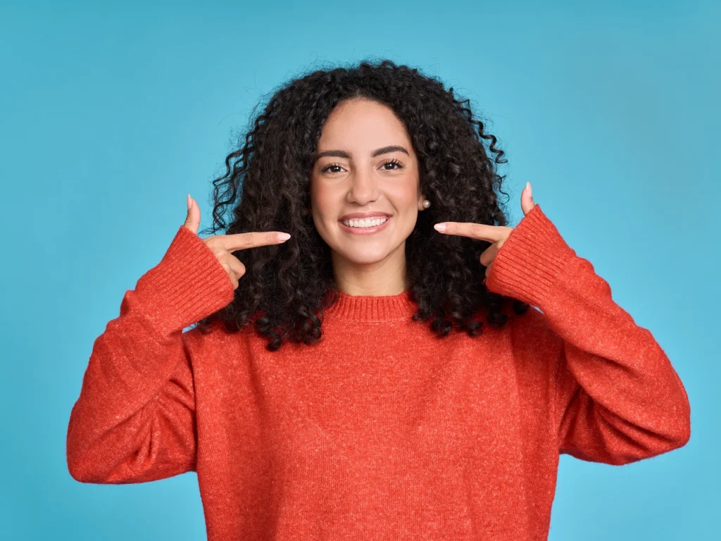 happy young woman smiling after her teeth cleaning in Manhattan Beach, CA